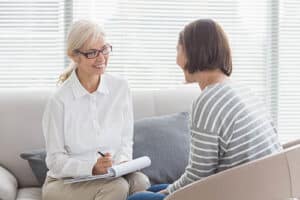 female therapist talking to female client about personality disorder treatment
