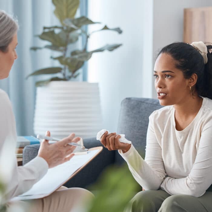 Woman learning about signs she may need to see a therapist.