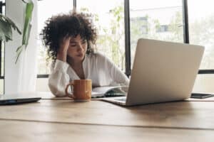 person experiencing workplace burnout is considering taking mental health leave and receiving virtual therapy at clear recovery center
